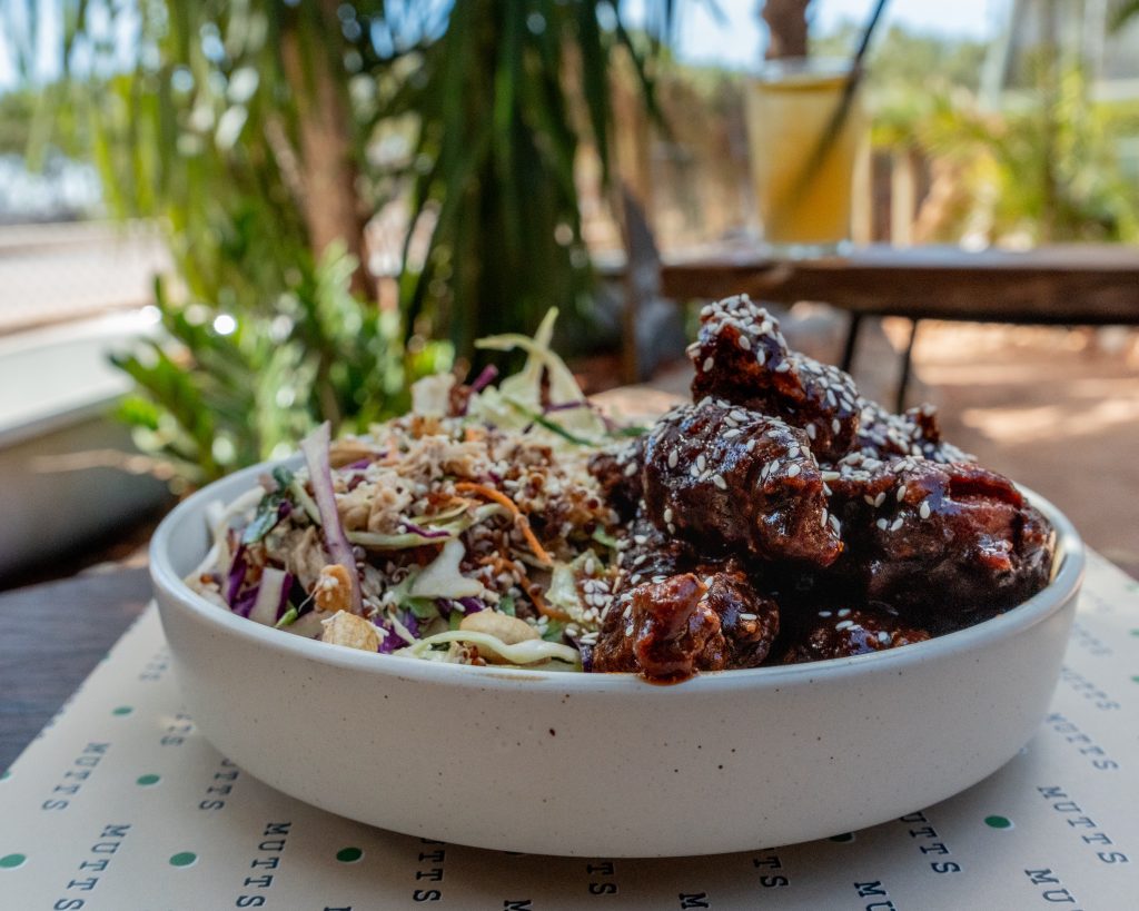 Oriental Salad with Asian Chicken Bites | Mutts Café Exmouth Oriental salad with Asian chicken bites served outside at Mutts Café Exmouth