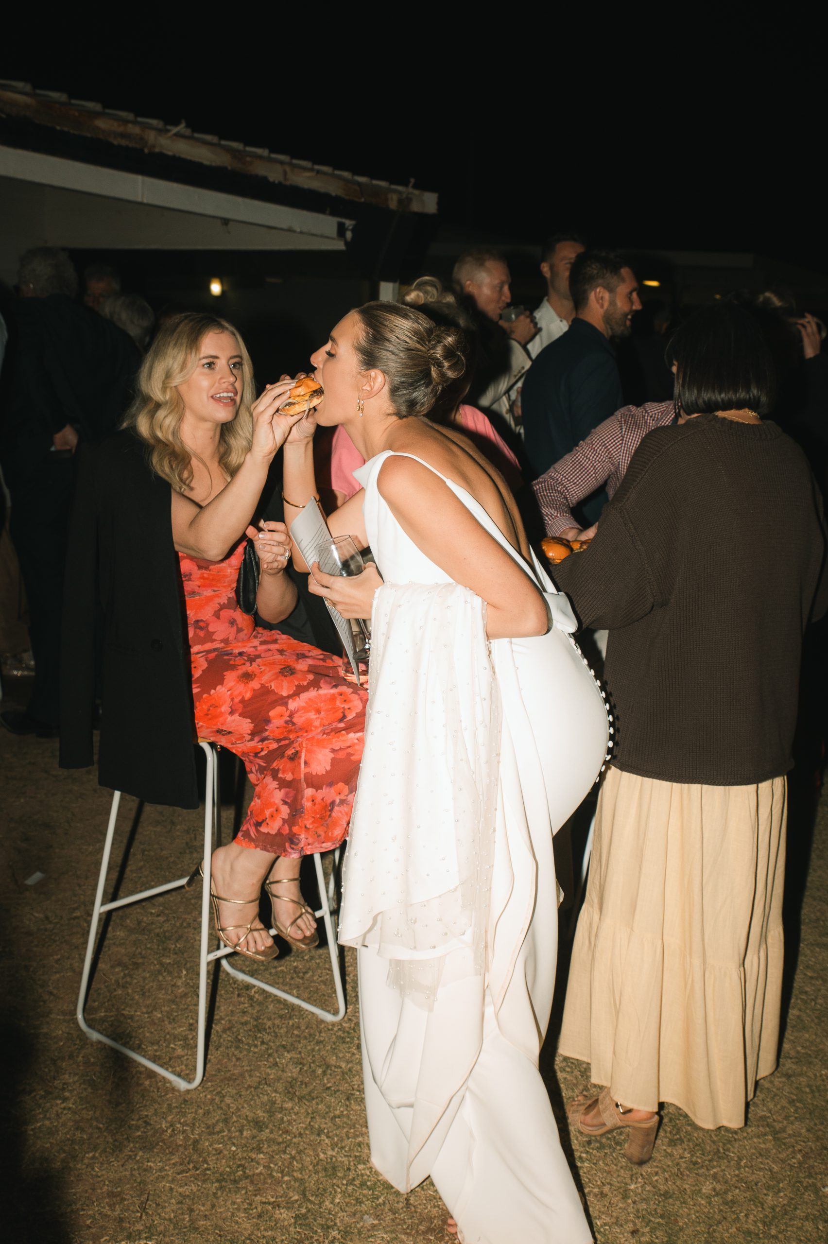 Bride enjoying a mini Mutts burger at a Mutts Wedding & Event Catering Exmouth