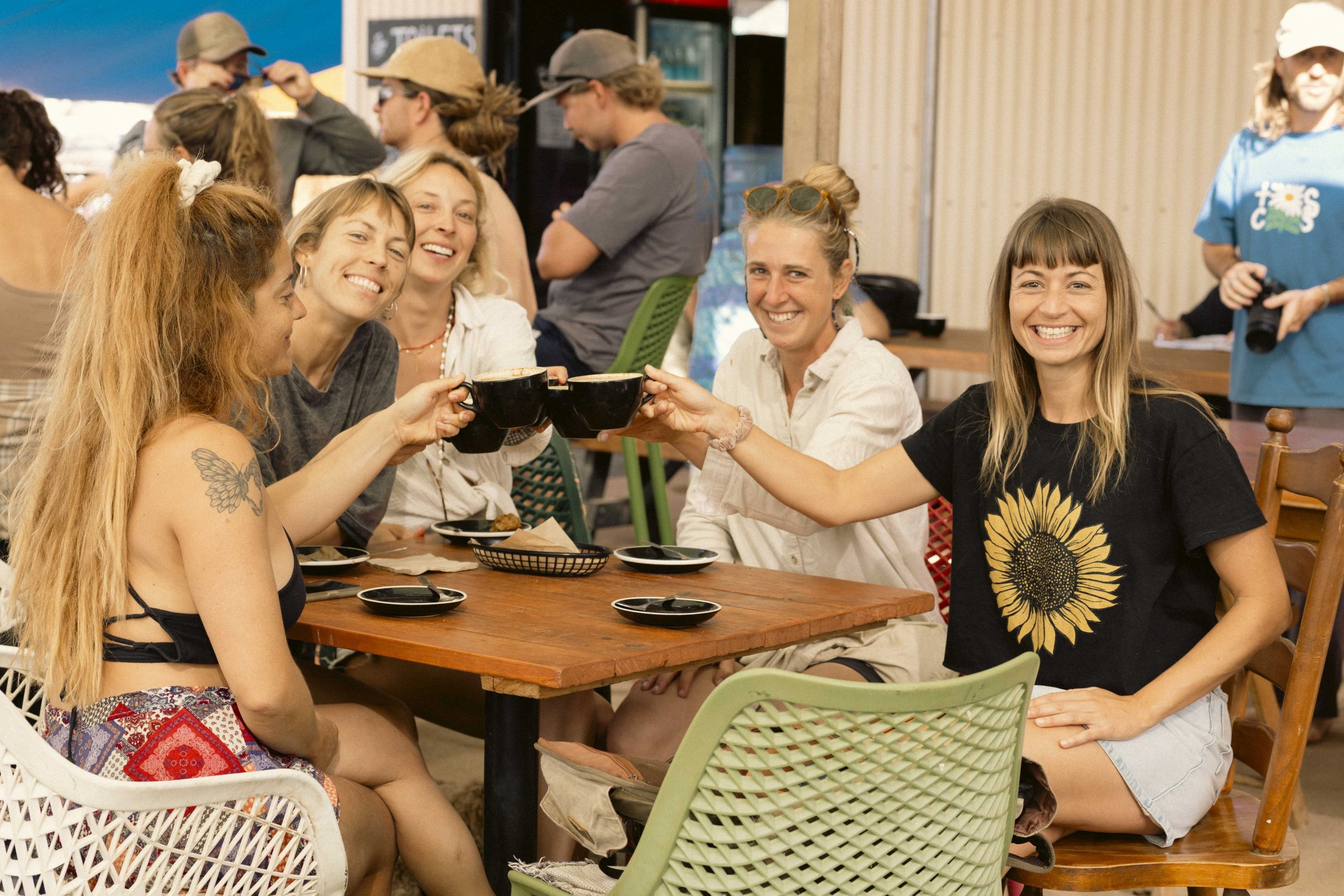 riends enjoying coffee together at Mutts Café Exmouth, celebrating community and connection. Contact Mutts Café Exmouth